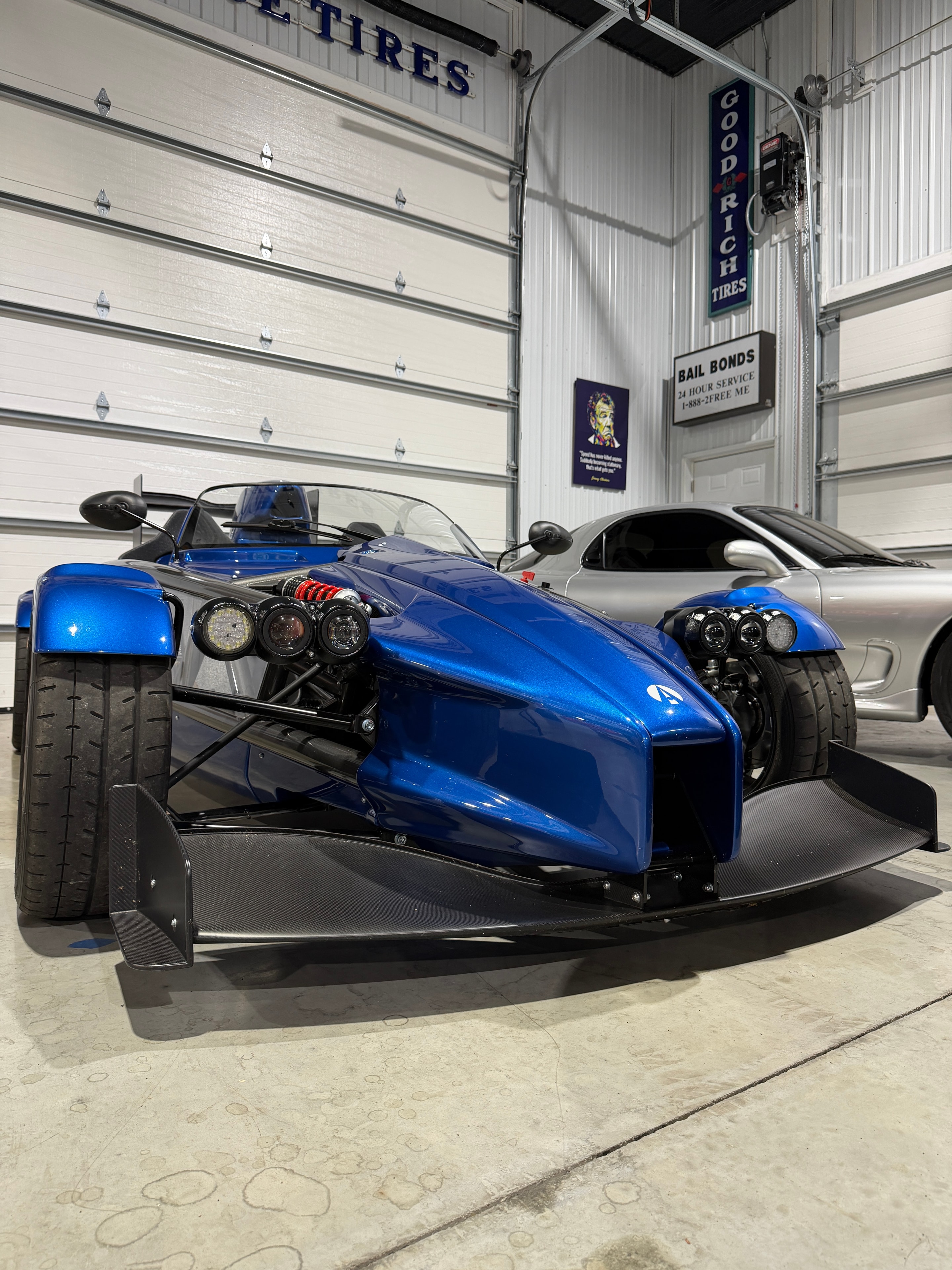 2025 Ariel Atom 4 — rear quarter with Ariel badge and carbon diffuser