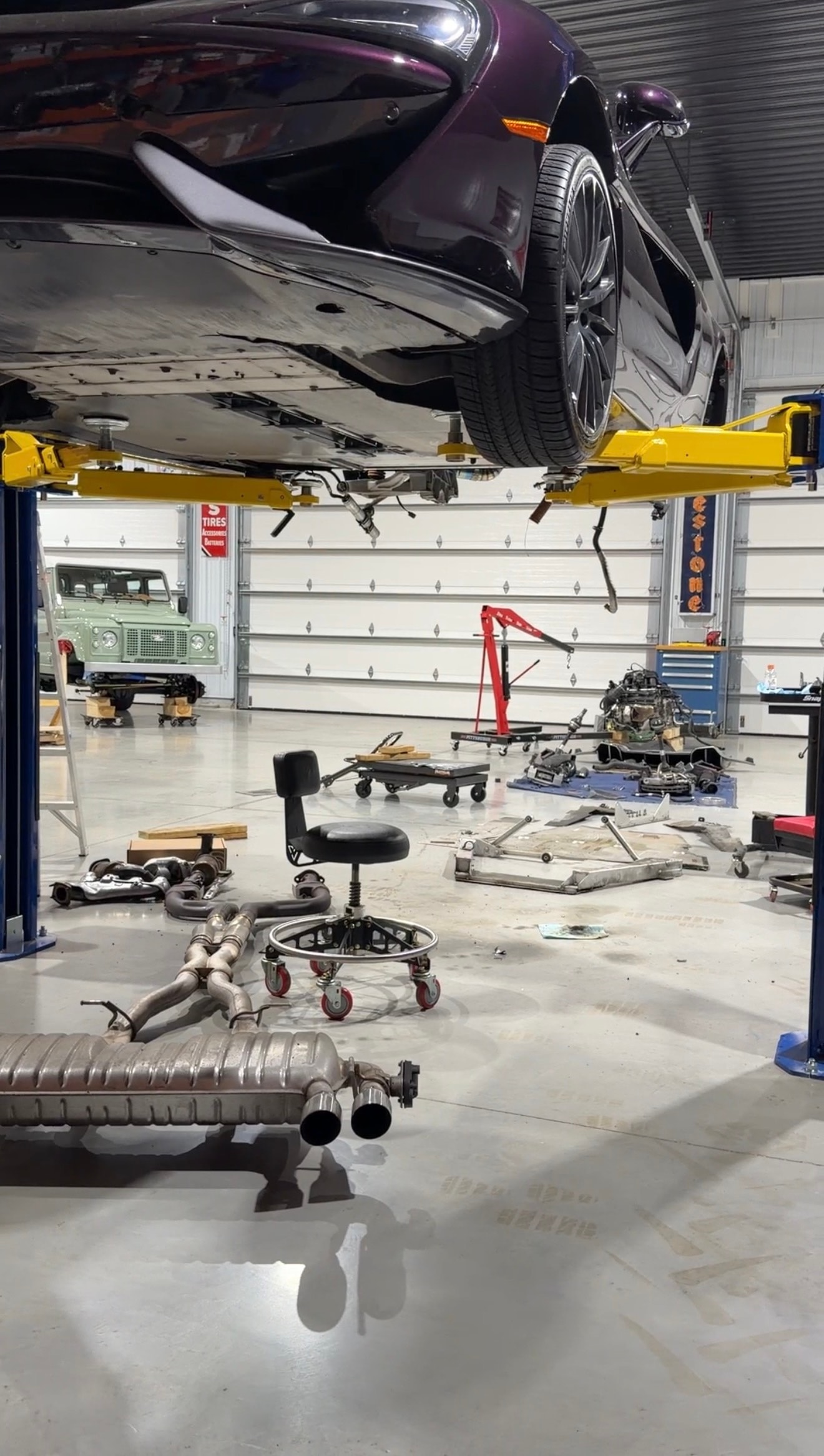 2018 McLaren 570GT — stock exhaust and components removed, car on lift