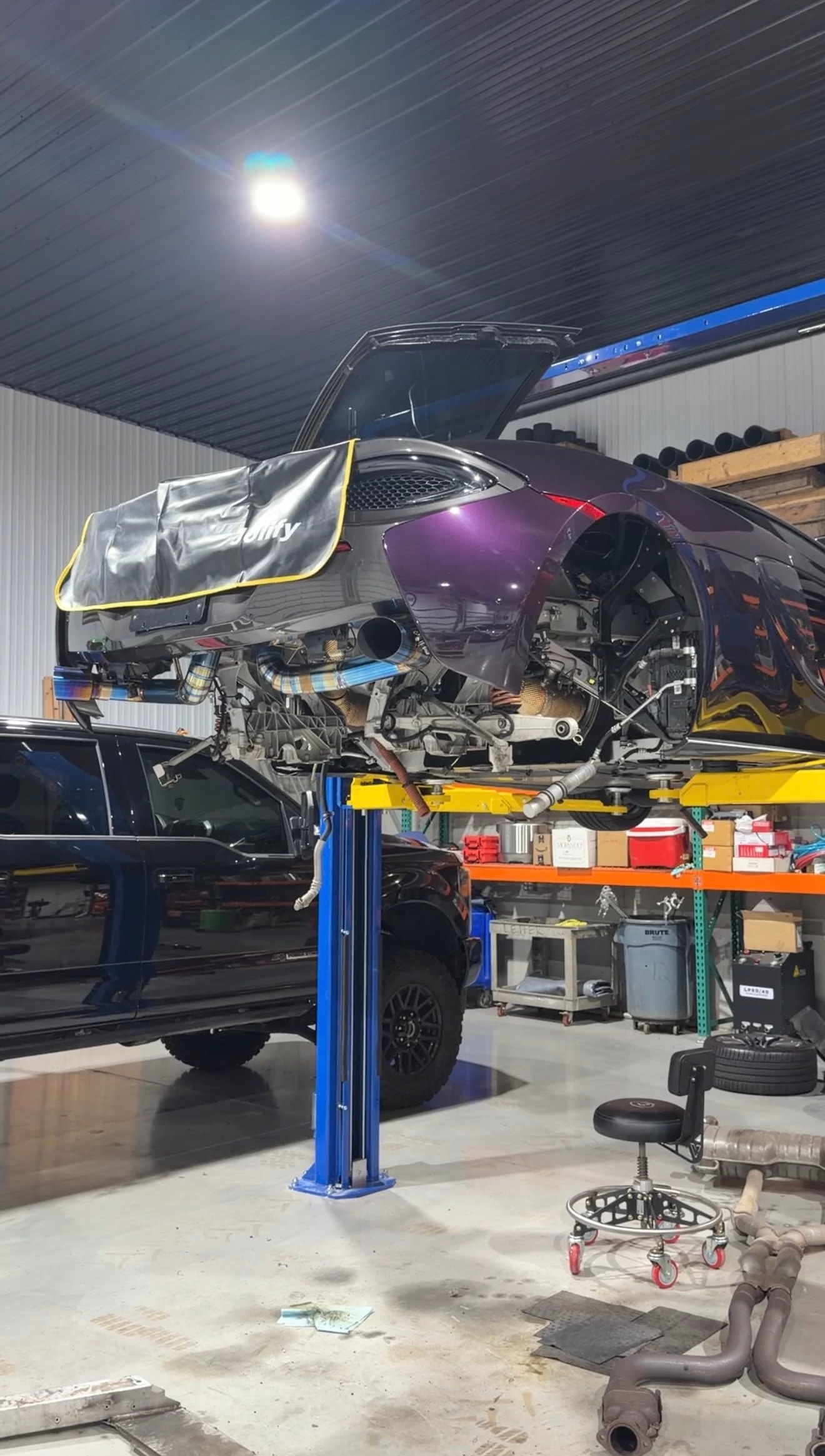 2018 McLaren 570GT Lantana Purple — rear end open on lift during engine removal