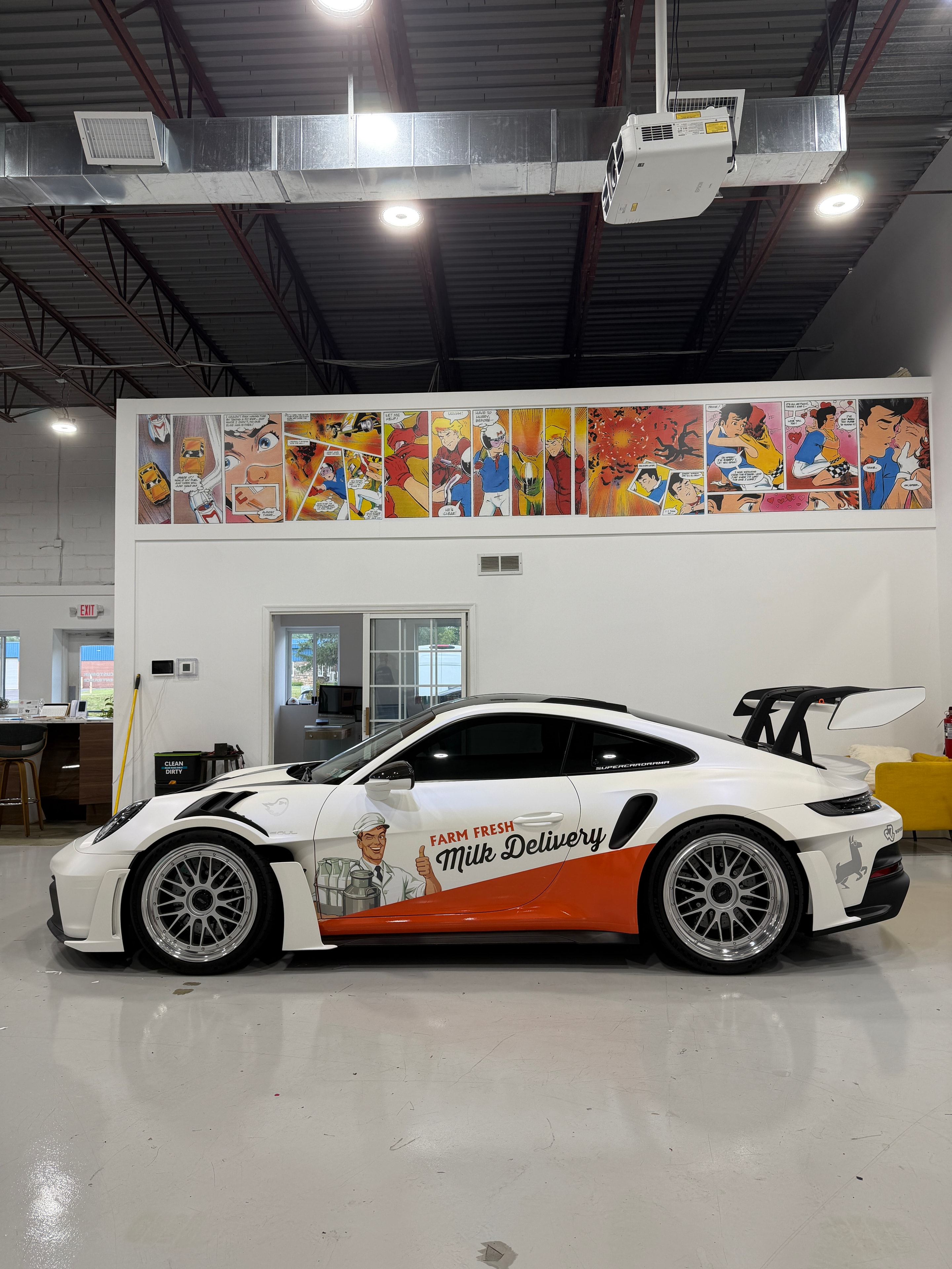 2025 Porsche 911 GT3 RS Milkman Spec — front view with Farm Fresh Milk Delivery wrap