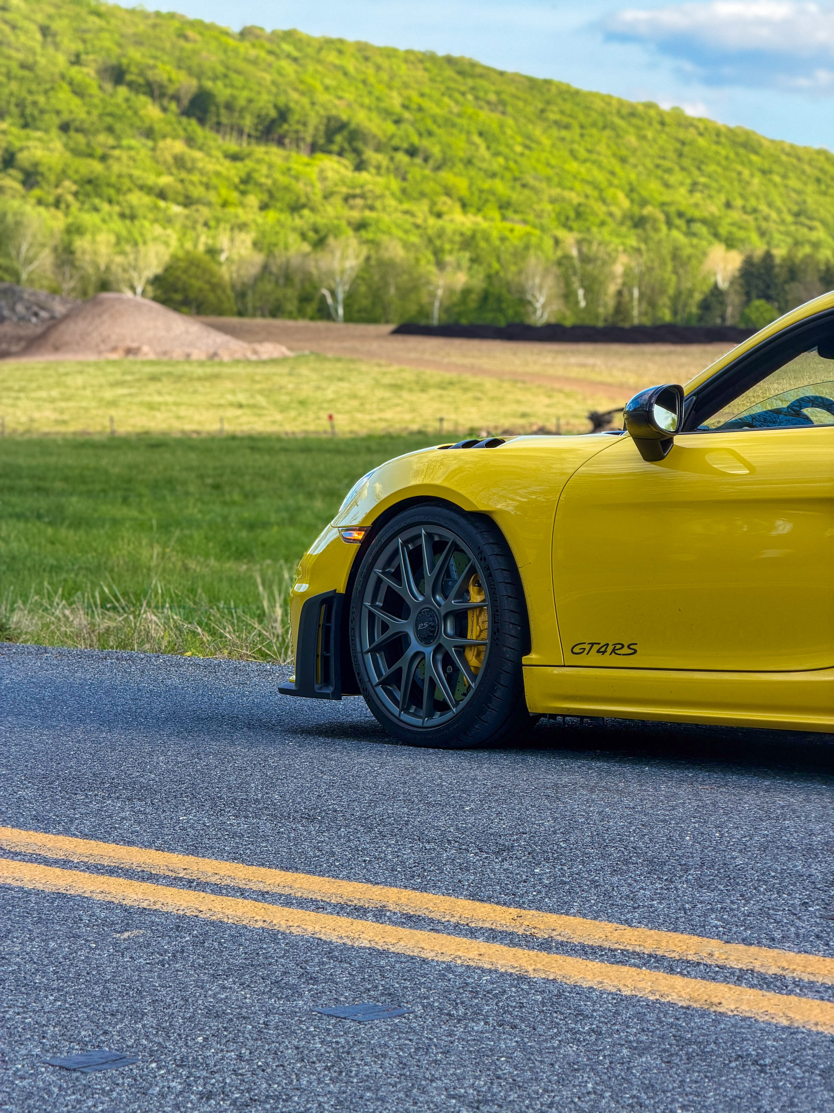 2024 Porsche GT4RS — front quarter on scenic road