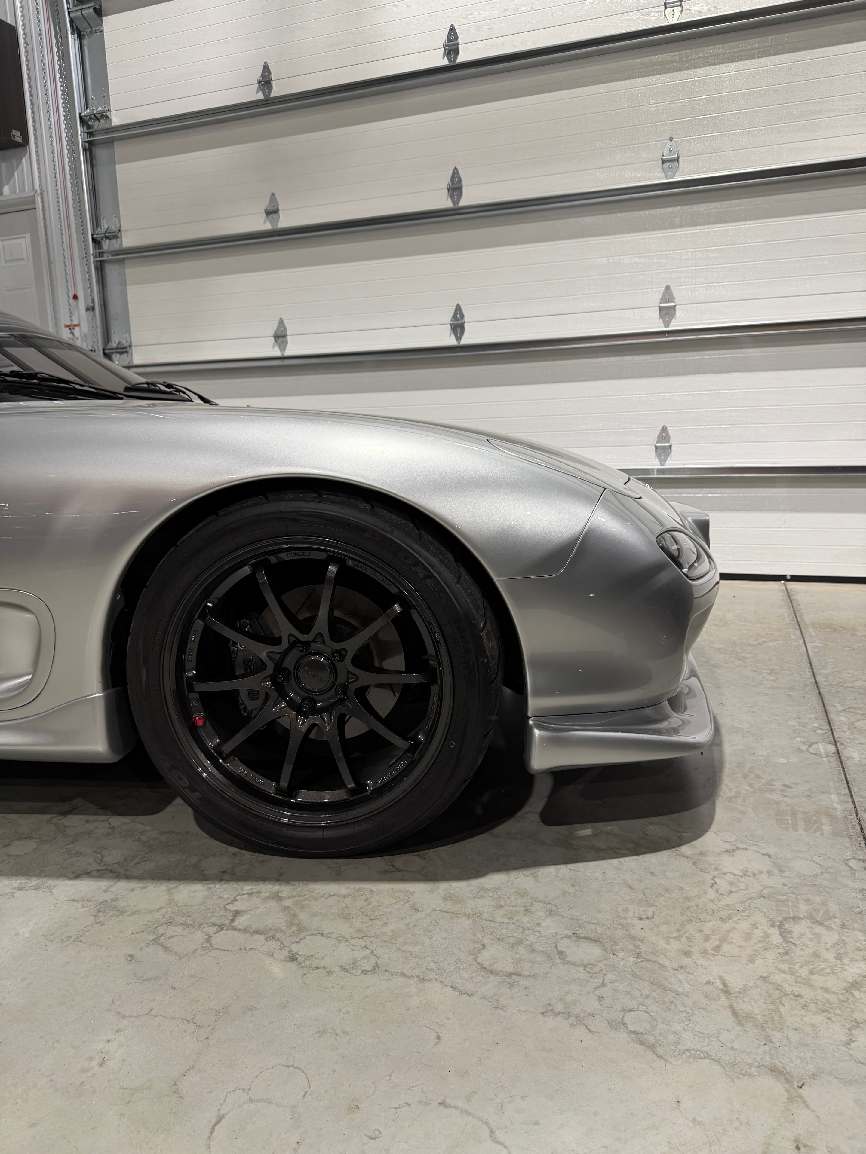 1993 Mazda RX-7 FD3S silver — rear quarter showing black wheel and bodywork